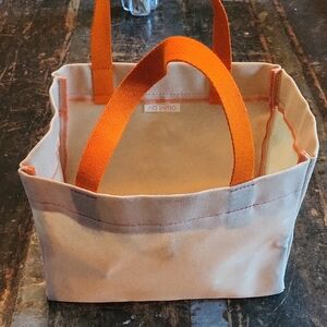 Canvas Tote with Bright Orange Handles and Cream Body